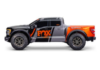 [Dış] Traxxas Raptor R - gri-turuncu gövde yandan görünüm