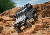 [Action] Traxxas TRX-4 Defender Combo - Gümüş Defender turuncu kaya tırmanışında ön süspansiyon esnemesi