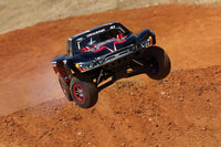 [Action] Traxxas Slayer Pro - siyah kırmızı 47 numara kaplama toprak rampada havada